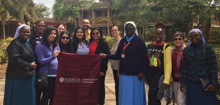 A group photo of several Kenyan nuns, GSE students, and staff