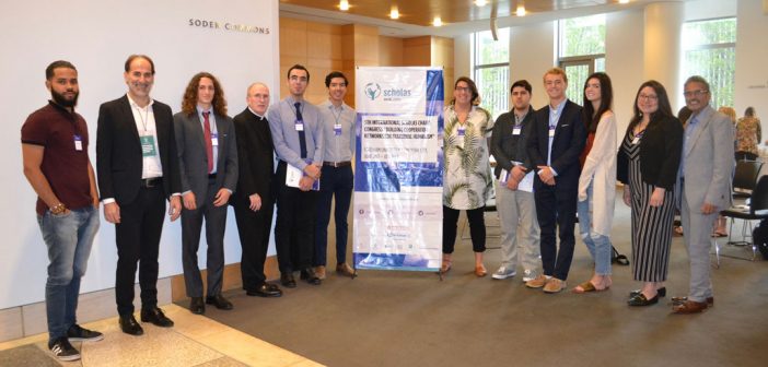 group standing with poster