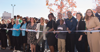 Fordham’s CEP Celebrates Community and Leadership Milestones group of Fordham stakeholders celebrating ribbon cutting